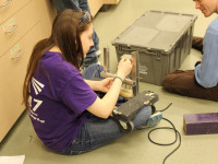 Spectrum team members working on the prototype for the 2015 robot