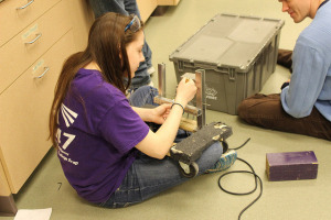 Spectrum team members working on the prototype for the 2015 robot